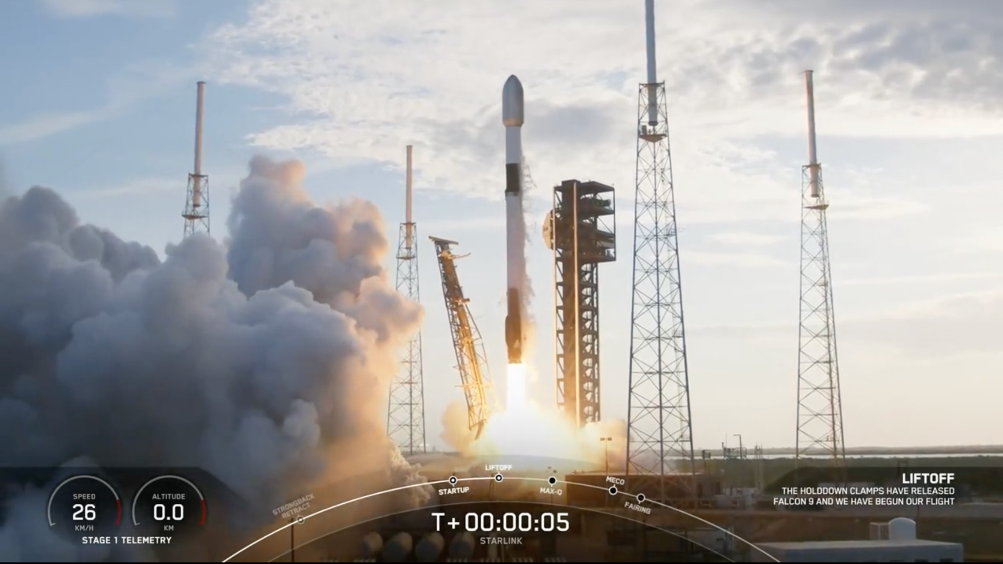 a black-and-white spacex falcon 9 rocket launches into a cloudy sky.