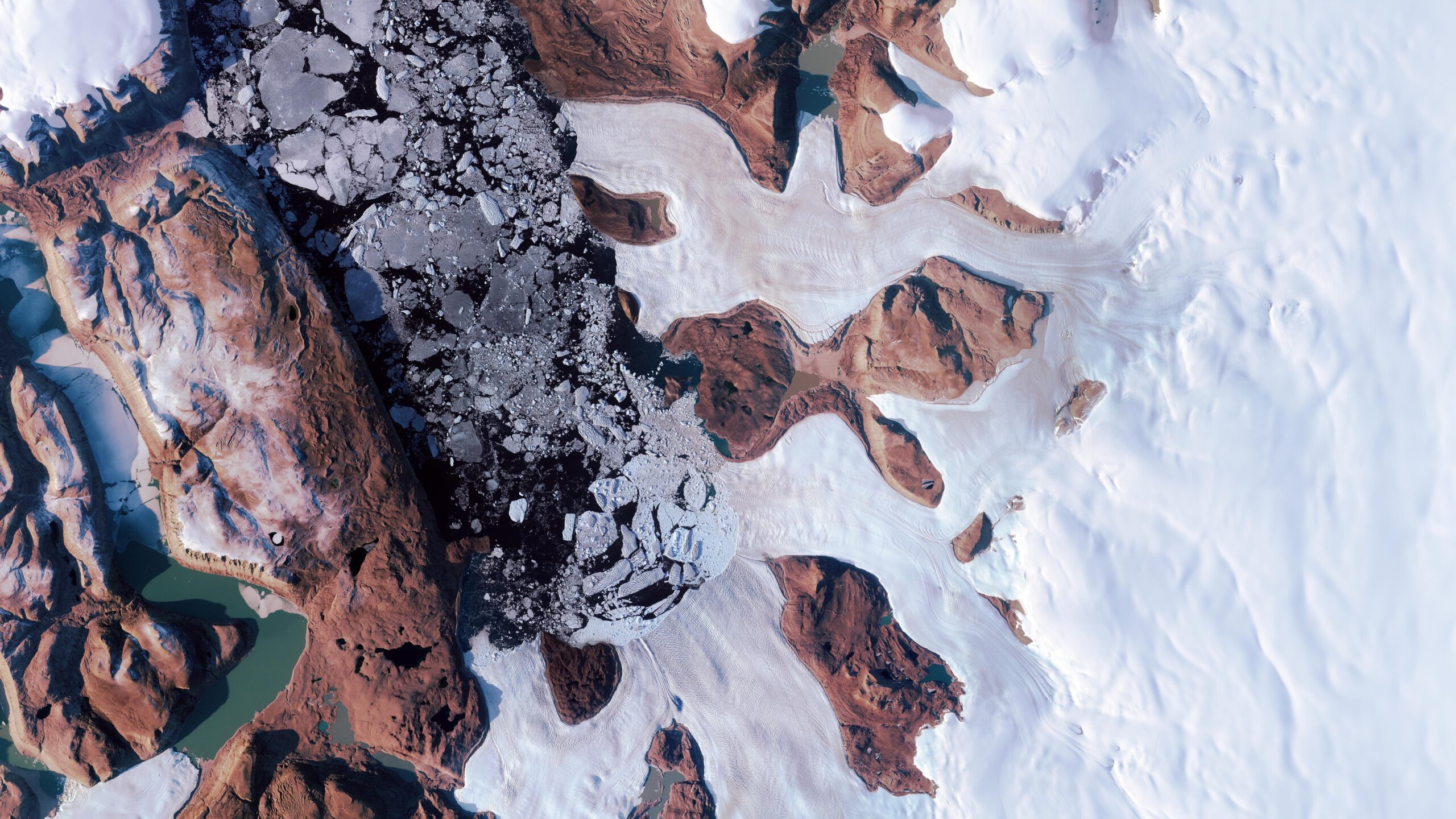 Satellites reveal a hidden lake burst through Greenland Ice Sheet in 2014, causing major flooding and a deep crater