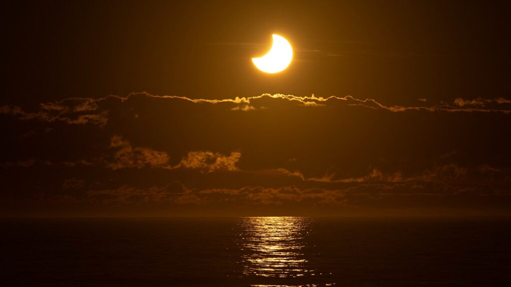 See the sun transform into a fiery crescent in breathtaking photos of the September 2025 partial solar eclipse