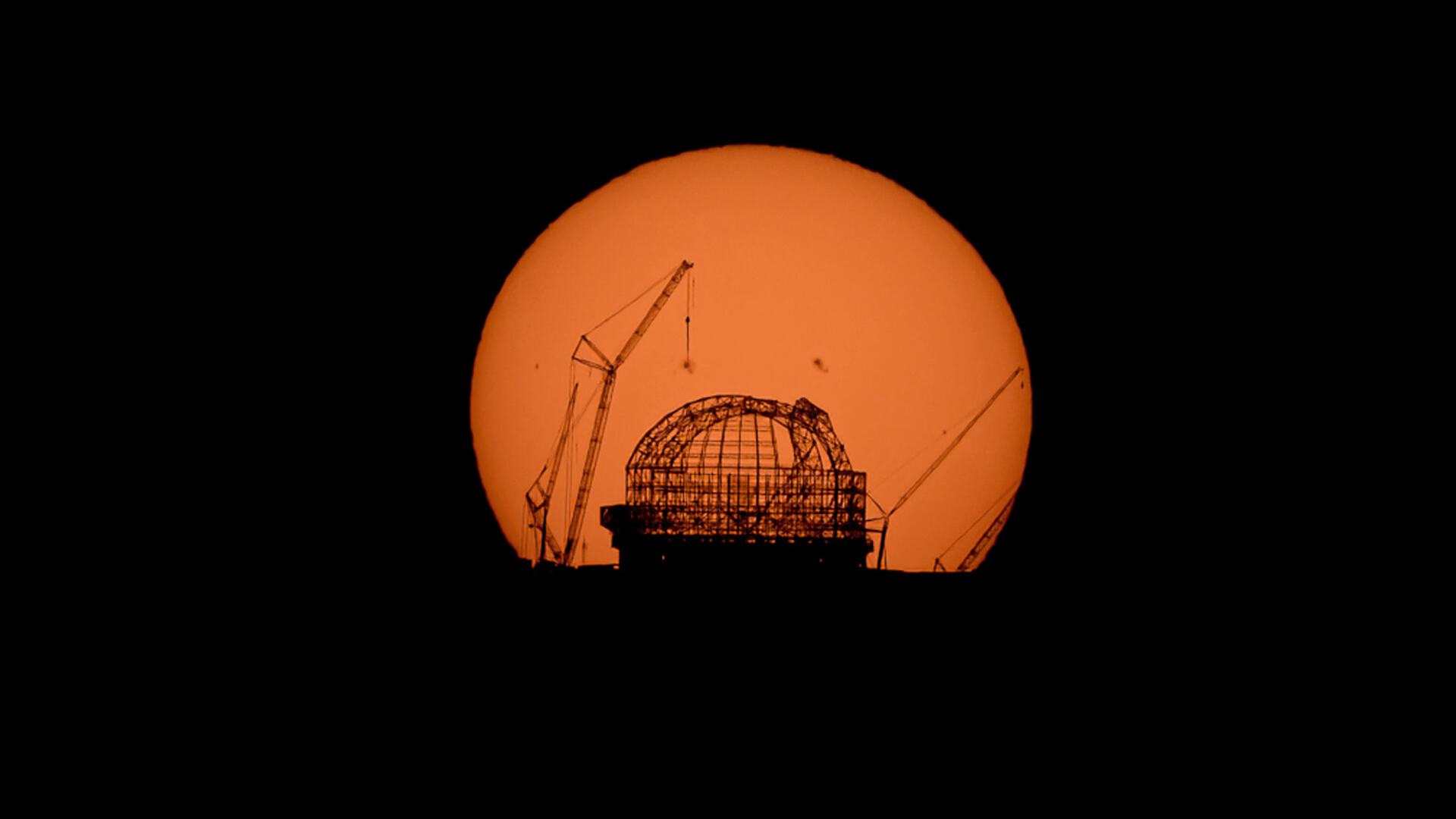 Sunrise silhouettes the world's largest telescope | Space photo of the day for Sept. 17, 2025