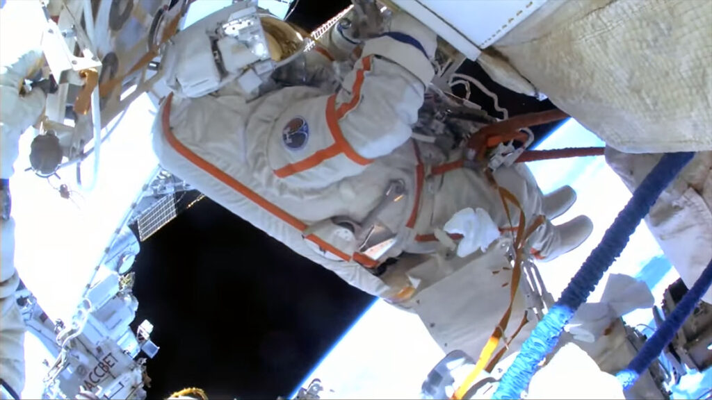 Spacewalking Russian cosmonauts install experiments on the International Space Station