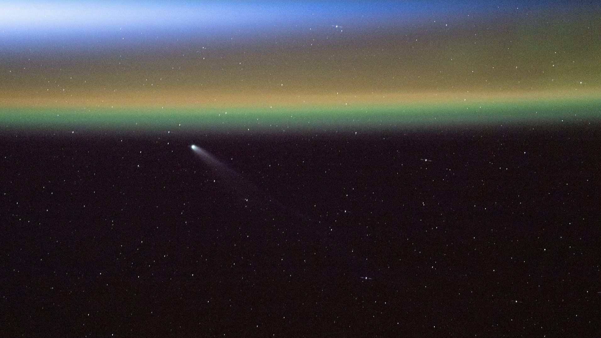 'Like a mermaid swimming through a sea of auroras': ISS astronauts photograph 2 comets dancing above the northern lights