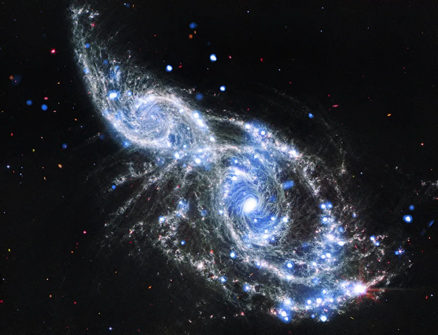 Space telescopes capture breathtaking galactic hug | Space photo of the day for Jan. 8, 2026