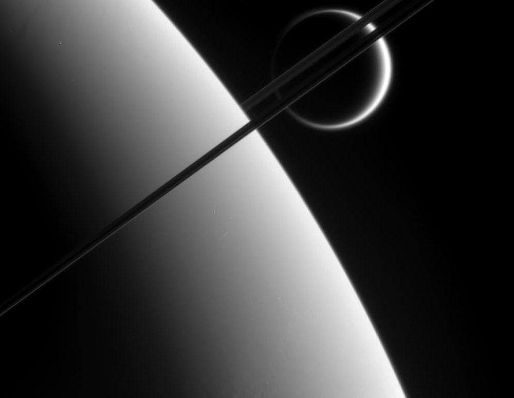 An Ancient Merger Could Have Created Titan and the Debris Created Saturn's Rings