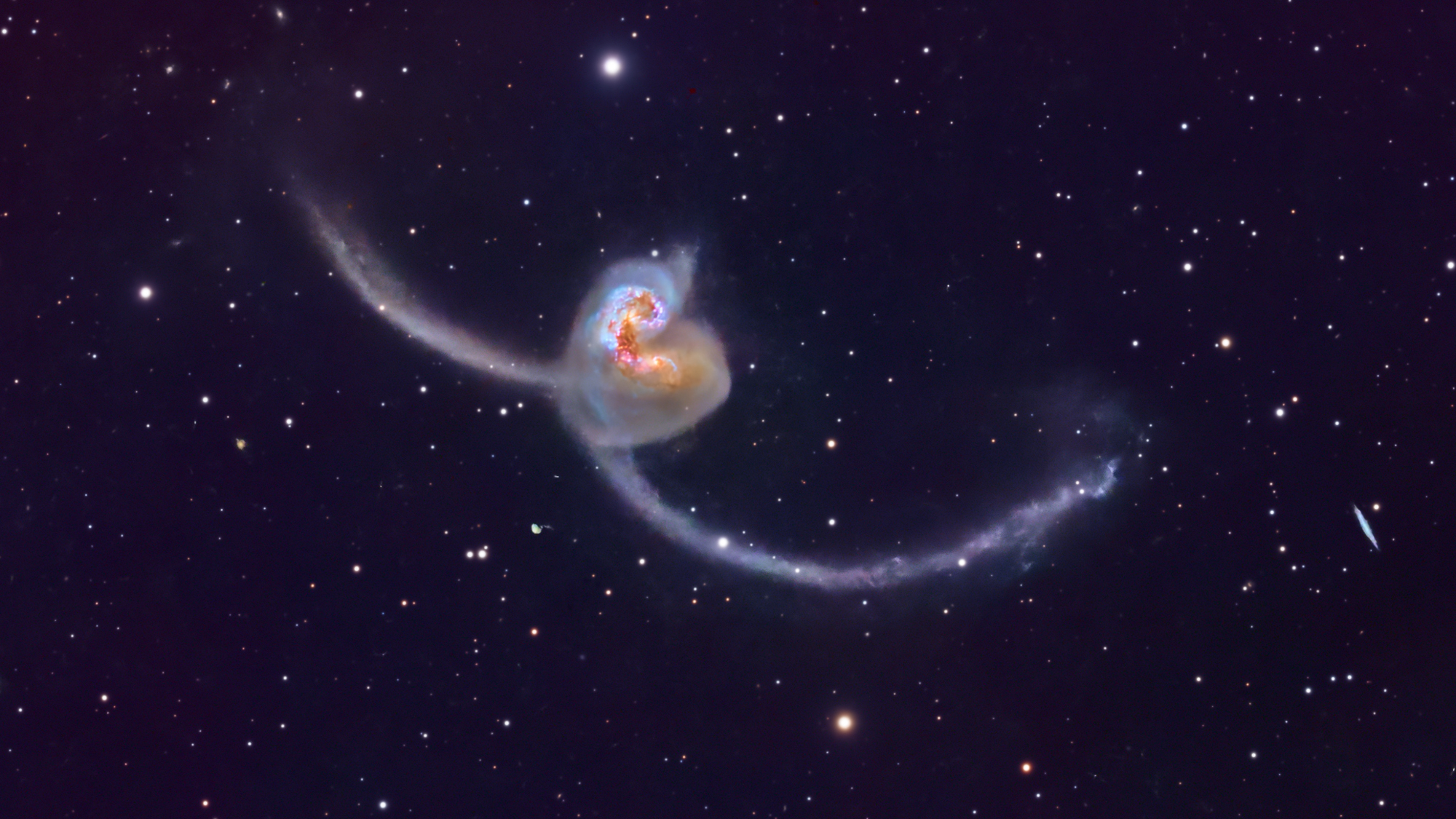 Astrophotographer captures spectacular photo of Antennae Galaxies dueling in deep space