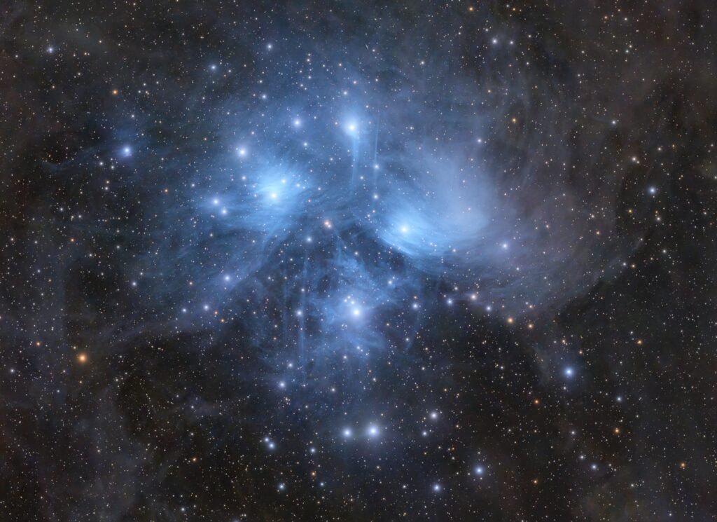 Astrophotographer captures Pleiades 'Seven Sisters' glowing through ghostly blue veil